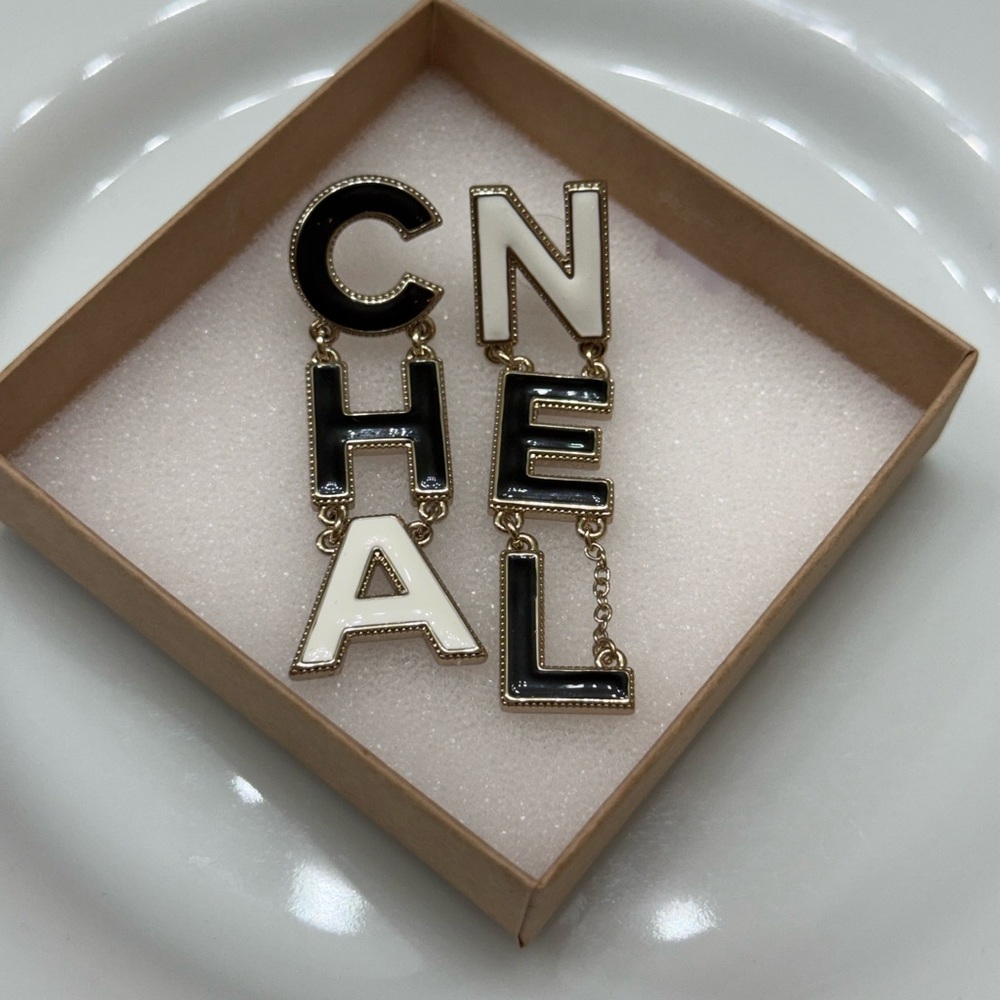 CHANEL Black and White Letter Earrings
